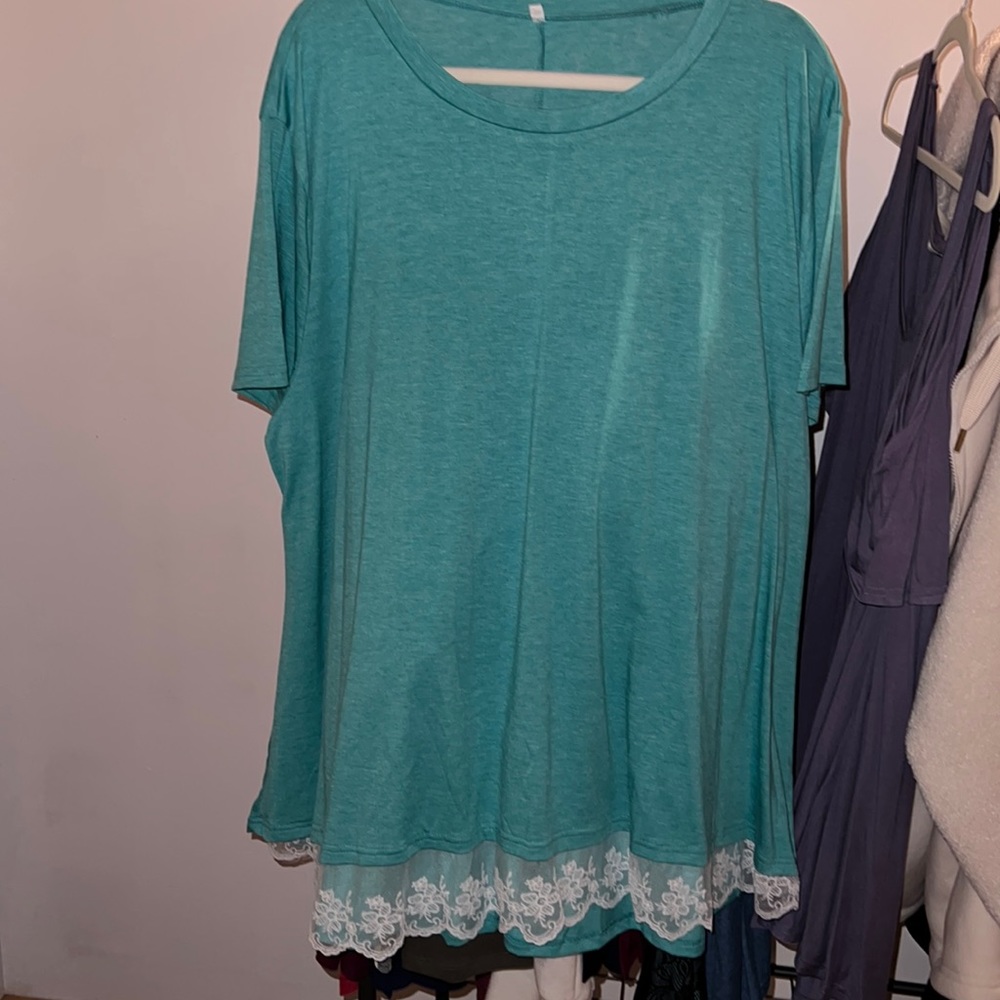 Top purchased from Amazon. Lace hem detail. Size 28W.